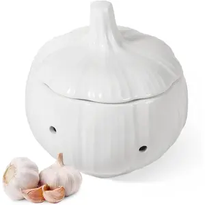 Ceramic garlic keeper shaped like a garlic bulb, countertop garlic holder with ventilation holes, smooth surface, kitchen storage garlic saver
