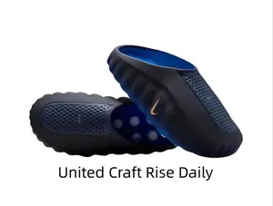 Comfortable Cushioned Black Slip-On Shoes with Perforated Upper and Bold Gold Logo Details