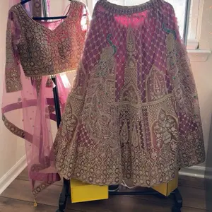 Indian Party Lengha in Pink and Gold Embroidery with Peacock Motifs and Rich Detailing for Festive Wear