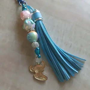 Alien MeansFamily Keychain with Blue Tassel and Beads Featuring a Gold Angel Charm