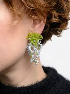 A pair of glass bead fringe earrings featuring a floral waterfall design, handcrafted earrings with a fresh, sweet style, perfect for a laid-back summer beach vacation look