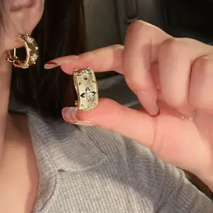 Brushed hollow four leaf clover earrings for women, high-end jacquard antique earrings and earrings