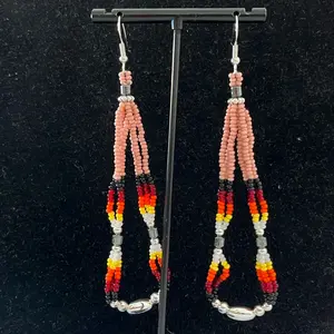 An elegant pair of Navajo handcrafted beaded earrings adorned with rose pedal blush seed beads, fire designed seed beads, hematite and silver alloy daisy shaped beads.
