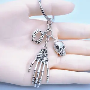Spooky Skeleton Hand and Skull Keychain - Durable zinc alloy, Gothic style backpack charm, exquisite design, perfect for Halloween and everyday use
