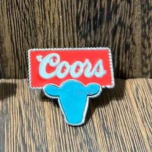 Beer logo turquoise cow head hat/purse pin