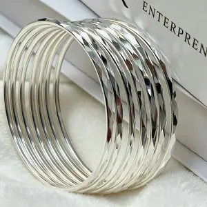 Women's 7-Piece Diamond Cut Silver-Plated Stackable Bangle Bracelets, Shiny Faceted Thin Cuffs, Hypoallergenic Minimalist Daily Costume Jewelry