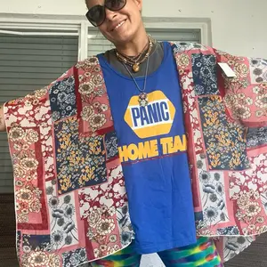 Widespread Panic Napa CA 2023 Tshirt Poncho One Size with Colorful Floral Design and "Panic Home Team" Text