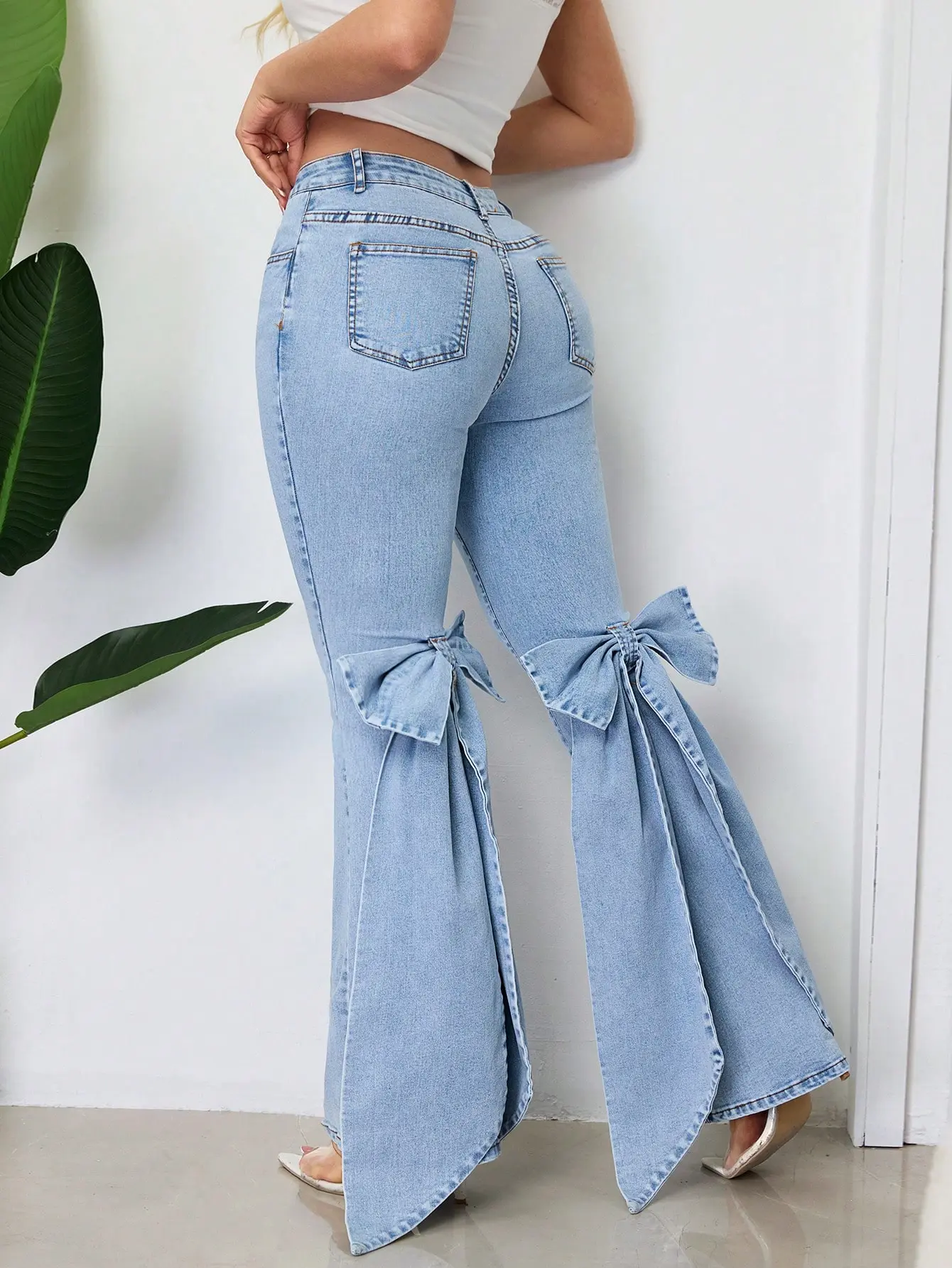 Women's Mid-Waist Washed Flare Jeans With Large Bow Ribbon Details