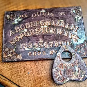 Shimmering Chocolate Colored Ouija Board with Matching Planchette Featuring Jasmine Buds and Engraved Lettering