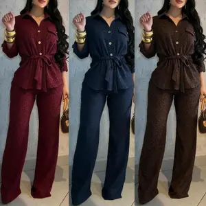 VVZ Women's Two-Piece Set: Textured fabric with a retro collar, rolled sleeves, and front-buttoned flap pockets. The top features a drawstring waist and is paired with loose-fitting pants with an elastic waistband. A perfect commuter outfit.