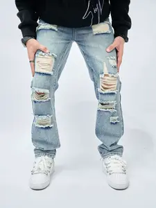 Men’s distressed ripped denim jeans set featuring a vintage blue wash, slim straight cotton pants, Y2K American streetwear, vintage distressed jean outfit, acid wash, distressed details, “Tears” jeans, and fashionable denim trousers.