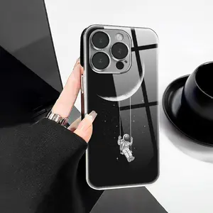 Creative Simple Astronaut Swing Under the Moon Pattern Electroplated Phone Case, PC + TPU + Glass Material, Shockproof Electroplated Glass Texture, Suitable for 17/16/15/14/13/12/11 PRO PROMAX PLUS AIR, Ideal Gift for Friends and Family, DDBLK21