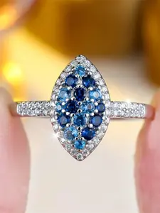 A geometric design ring featuring synthetic blue crystal zirconia, stylish and suitable for wearing at weddings, Cubic Zirconia Rings