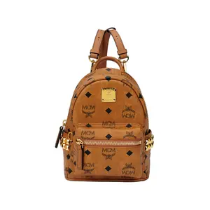 MCM Coated Canvas and Leather Backpack with Monogram and Studs, Mini Size, Unisex Couple Style in Brown Cognac