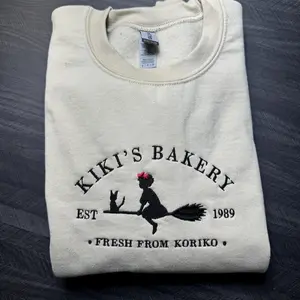 Embroidered KiKi's Bakery Unisex Crewneck Sweatshirt, Jiji Shirt, Kiki's Delivery Service, Studio Ghibli Sweatshirt, Hayao Miyazaki Shirt