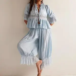 Women’s lace-trim two-piece pajama set, Y2K style, featuring a short-sleeve shirt with a front bow tie and ruffle flared lantern pants; loungewear/nightwear; check pattern; light color.