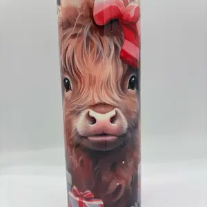 20oz Skinny Christmas Highland Cow Tumbler with Festive Red Bow and Snowy Design
