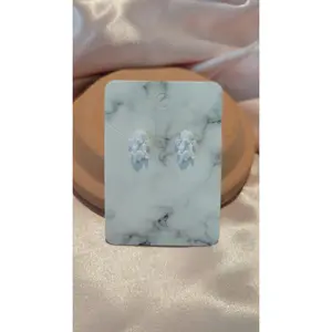 Angel Studded Earrings (White) by When The Sun Doth Sleep