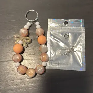 Keychain with phone lanyard tab