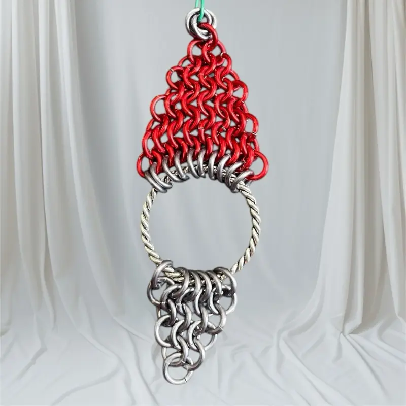 Christmas ornaments handmade out of chainmail .