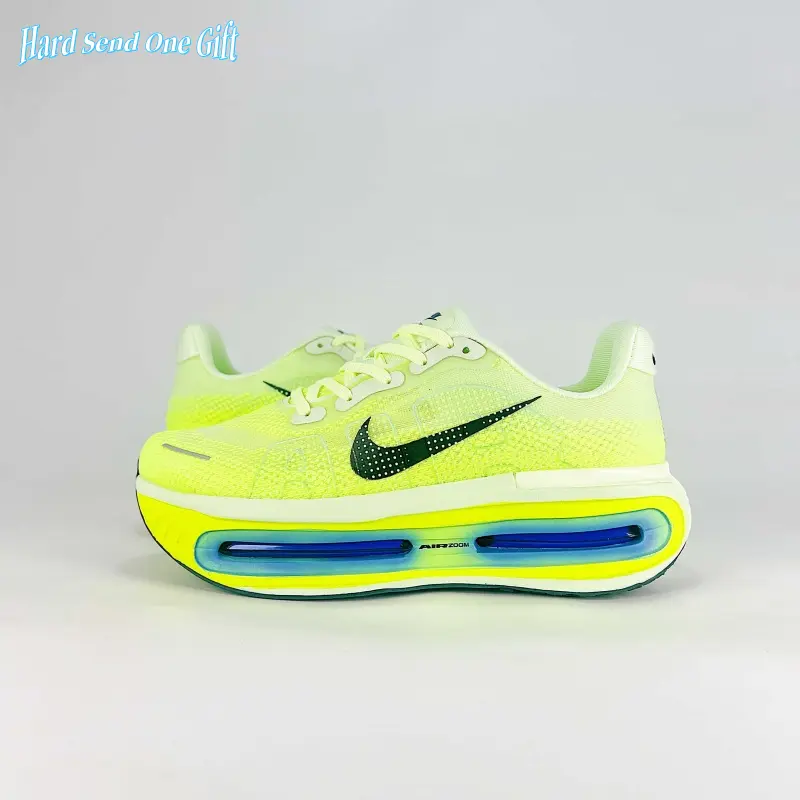 Streetwear performance running kicks carry bold vibrant neon sporty vibe, blending sweat-wicking sheer thin knit mesh and full responsive air cushion midsole, solid lime yellow tone with deep blue transparent cushion layers, grippy rubber sole