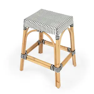 Butler Specialty Company Robias 24.5 in. Seat Height Rectangular Rattan Backless Counter Stool with Footrest, White and Black Dot