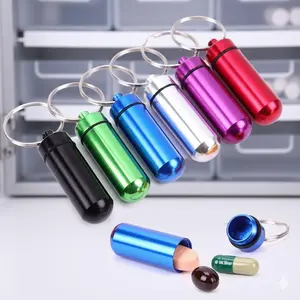 Portable Mini Sealed Pill Case Keychain: Essential Outdoor Travel First Aid Kit, Multifunctional Storage Bottle for Camping Hiking Office Daily Organizer with Hook, Wearable as Accessory.