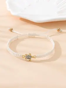 This minimalist metal sea turtle bracelet features CZ accents and a braided design—perfect for ocean lovers and a trendy choice for the young at heart
