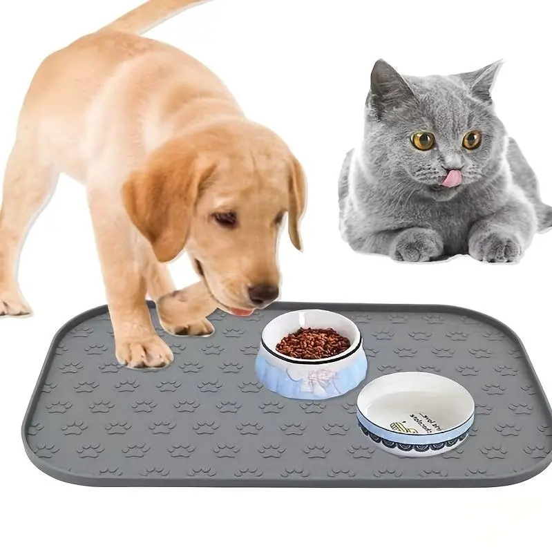One Pet Food Mat Designed with Paw Prints, Ideal for Both Cats And Dogs, Includes Designated Areas for Eating And Drinking, Made from Silicone, Features an Anti-Slip Design, And Has Raised Edges to Keep Food from Spilling