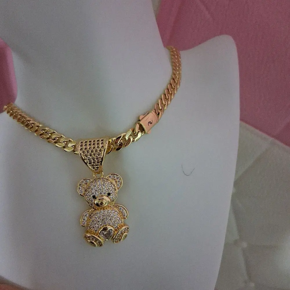 Gold plated chain ,6millimeters thick 16  inches long with bear pendant.
