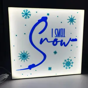 I Smell Snow - LED Light Up Sign with Snowflake Design and Blue Text for Festive Decor