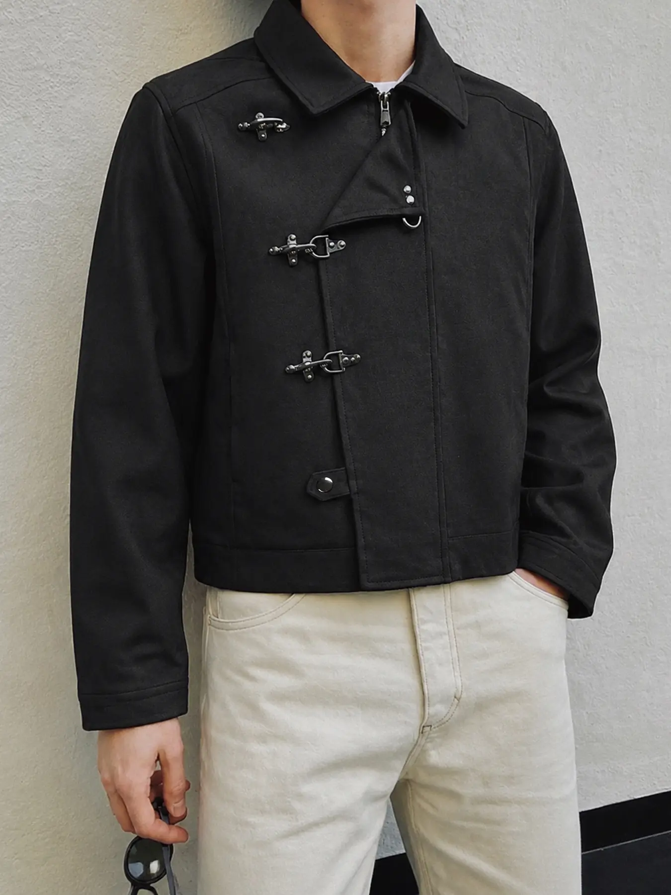 Practical men's jacket in a minimalist style, featuring metal buckles and a front zipper, with side pockets. A business-casual top perfect for layering in the fall to create street-style looks.