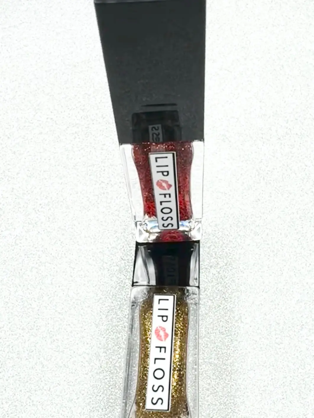 HAWT GURL SUMMA COLLECTION Bronze Suga and Ruby Wine  Lip Floss High Shine lip gloss is a non-sticky formula enriched with shea butter and vitamin E to moisturize and soften lips. It provides a high-shine, lightweight, and is long-lasting    4.5ml