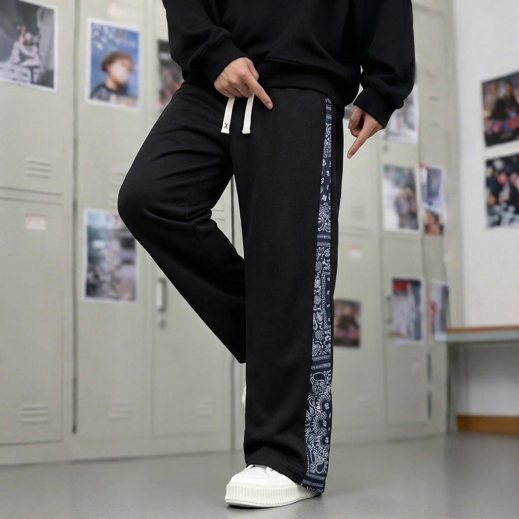 Men’s casual pants featuring an elastic waistband and drawstring design, floral side pattern, side pockets, and slight stretch—comfortable athletic casual pants.