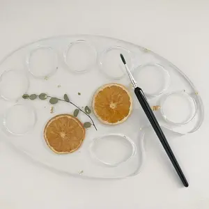 Resin color palette with pressed flowers and fruit