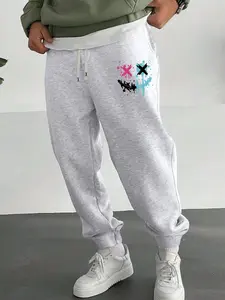Spring and autumn models of the new men's ribbed trousers simple style smiley pattern printing casual sports regular large size elastic waist drawstring trousers fashionable versatile trousers men's drawstring trousers