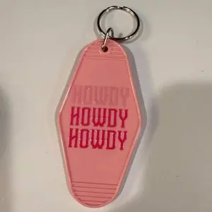 Pink Hotel Room Keychain with "Howdy" Design