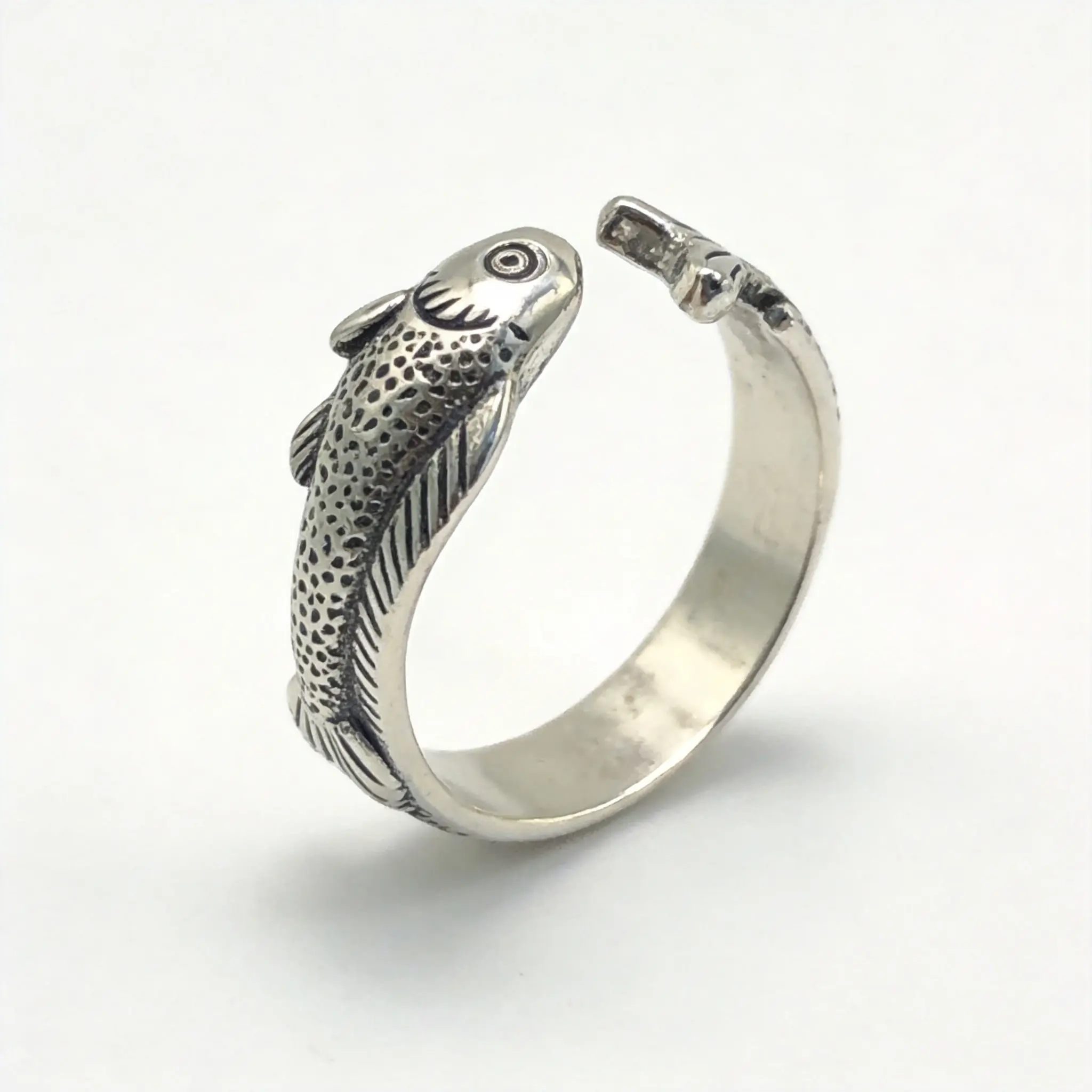 Bohemian-style vintage fish-shaped ring with an antique matte silver finish and a natural vintage texture. The adjustable open design gives it a playful and retro vibe, making it a versatile vintage ring perfect for everyday wear.