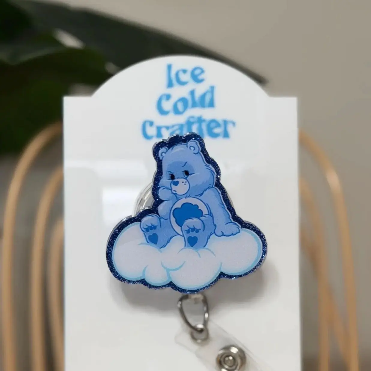 Grumpy cloud bear badge reel