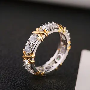 A luxurious, gentle and individual two-tone X-shaped ring.