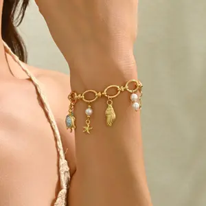Ocean-Style Bracelet — Metal Shell & Turtle Design with Enamel Accents and Pearl Inlays — A Stylish and Versatile Wrist Accessory