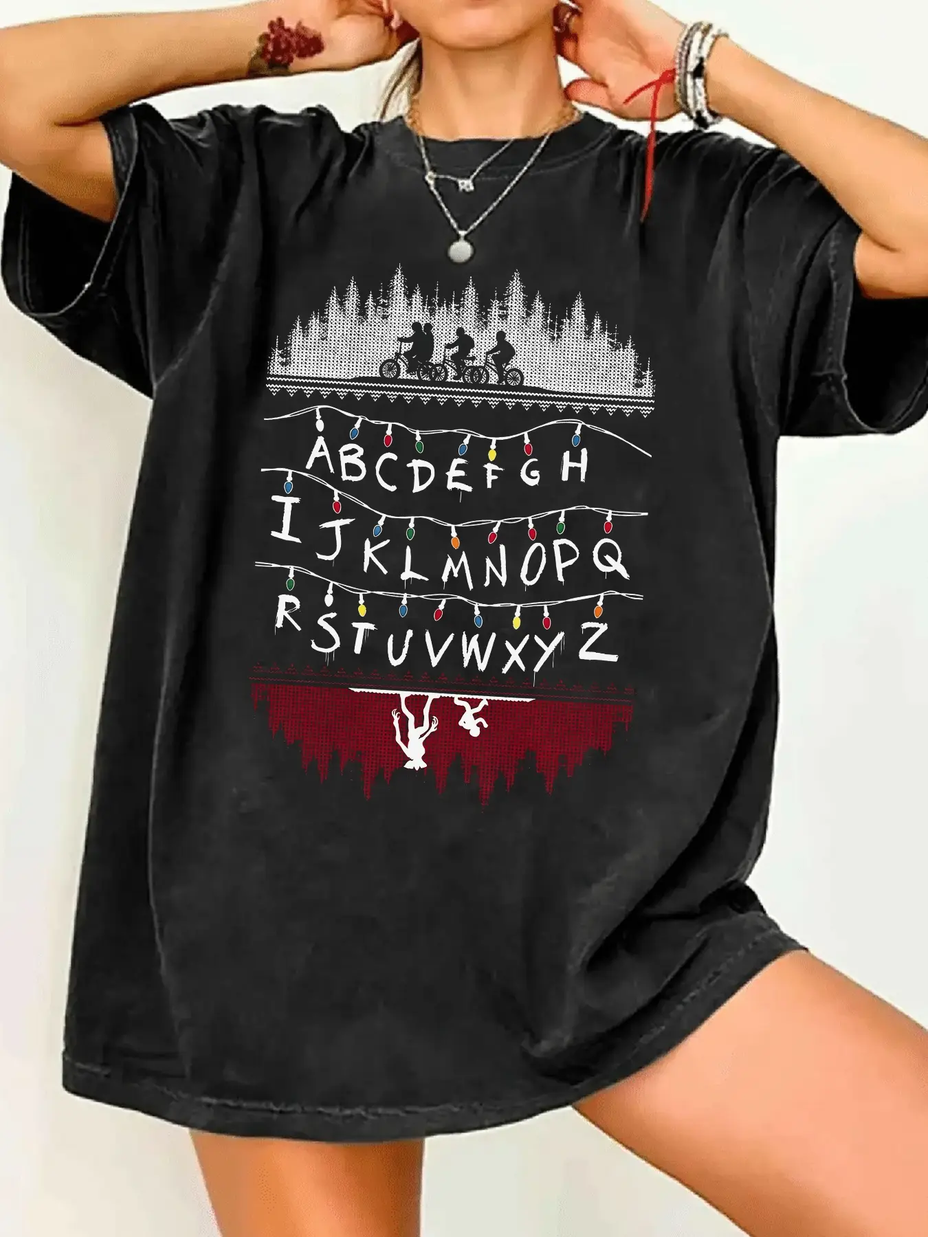 Stranger Things Christmas Alphabet Lights Graphic Print T-Shirt - Biking Teens & Demogorgon Pattern, Women's Oversized Crewneck Short Sleeve Vintage Black Casual Tee, Casual Tee Shirts, Casual Tops, Summer Soft Fabric, Xmas Gift for Series Fans