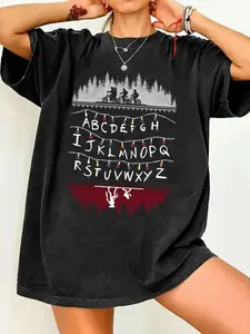 Stranger Things Christmas Alphabet Lights Graphic Print T-Shirt - Biking Teens & Demogorgon Pattern, Women's Oversized Crewneck Round Neck Short Sleeve Vintage Black Casual Tee, Summer Soft Fabric, Xmas Gift for Series Fans