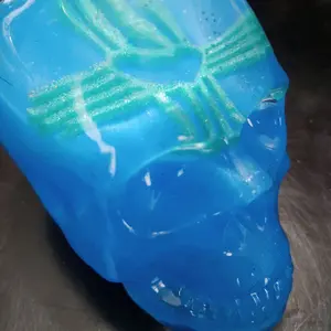 Blue and Clear Epoxy Skull with Green Zia Heart Symbol - Unique Decorative Piece for Home or Office