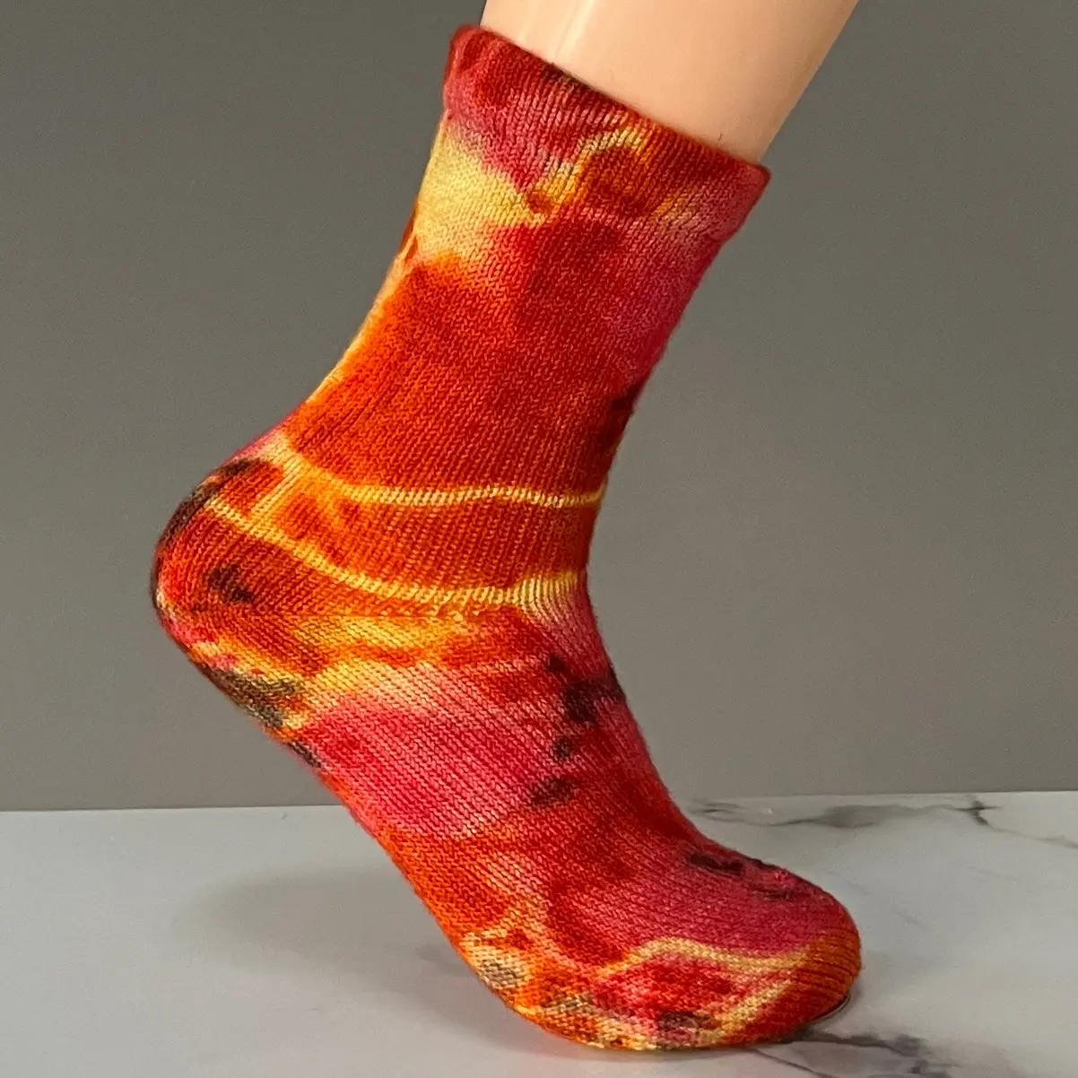 Ladies size 7-9/ Men’s 5-7 Hand knit, hand dyed 100% Merino Wool Sock