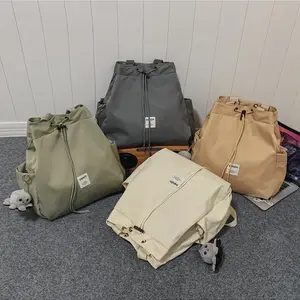 Niche drawstring shoulder bag solid color schoolbag women's lightweight large-capacity student leisure commuting versatile backpack