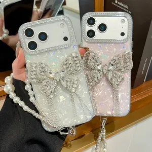 Shell Texture Heavy-Duty Full Rhinestone Bow Phone Case with Pearl Rhinestone Chain Strap For iPhone 13/14/15/16/17 Pro/ProMax/Plus, Luxury Rich Girl Style Cover