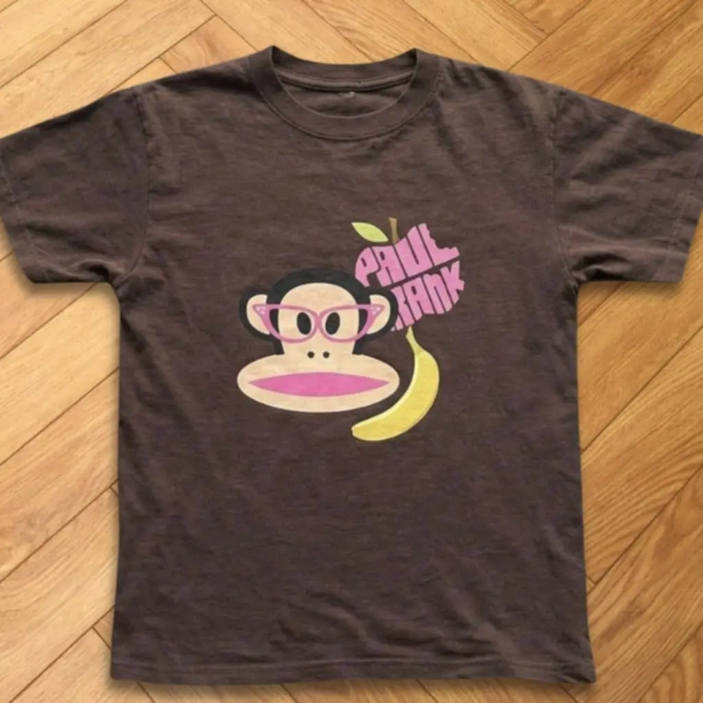 Playful Monkey And Banana Brown Baby Tee With Colorful Cartoon Design