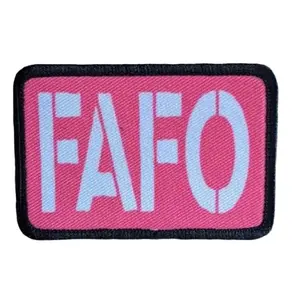 Fuck around and find out pink funny 2"x3" morale patch with hook and loop backing green background