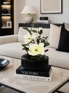 MAGNOLIA WITH BRANCH IN BLACK VASE